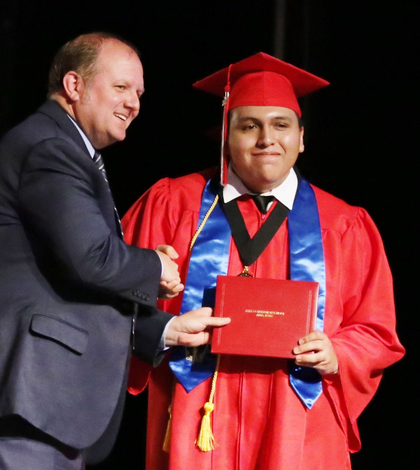 Alba-Golden honor graduate Jose Camacho receives his diploma from principal Michael Mize.
